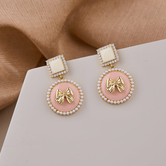Pink and White Pearl Bow Drop Earrings with Gold Accents