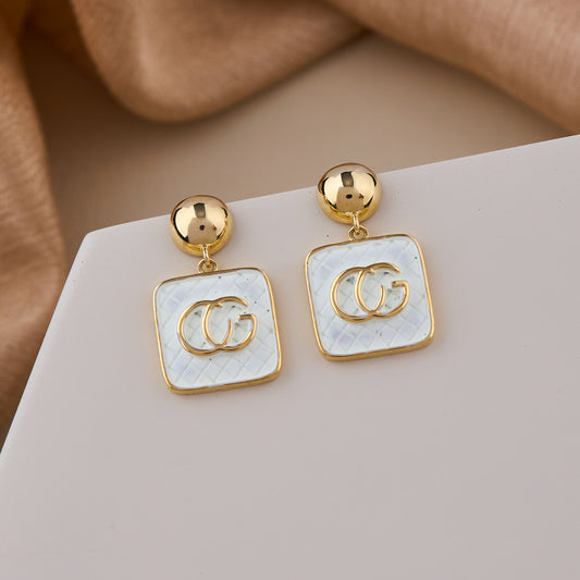 Elegant Gold-Plated Drop Earrings with White Enamel Squar