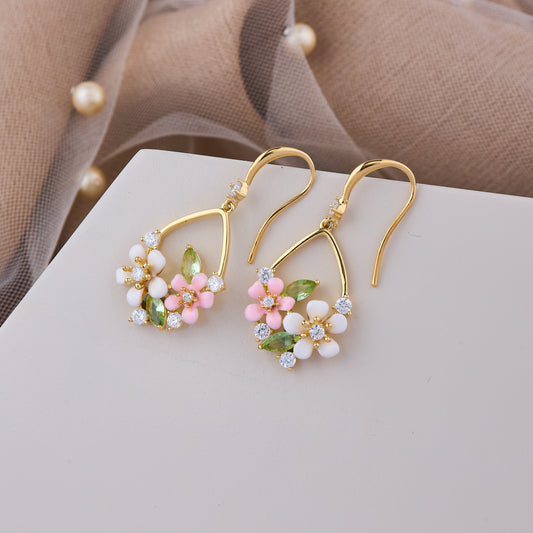 Gold Hook Earrings with White and Pink Flowers, Green Leaf Accents, and Crystal Detailing