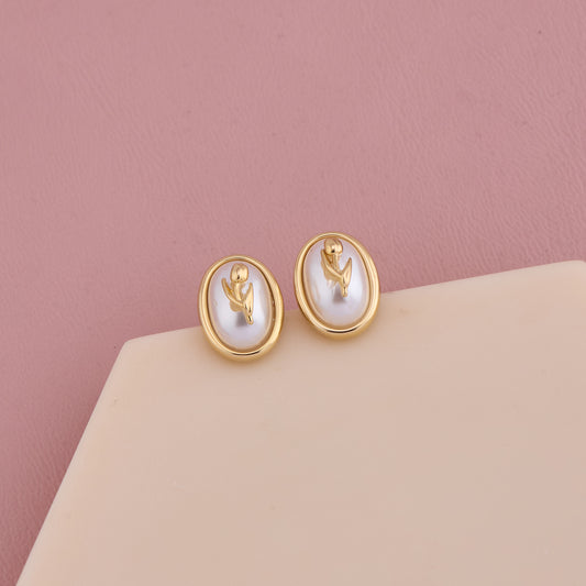 Elegant Oval Pearl Stud Earrings with Golden Floral Motif