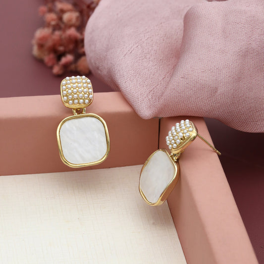 Elegant Gold Earrings with Intricate Design