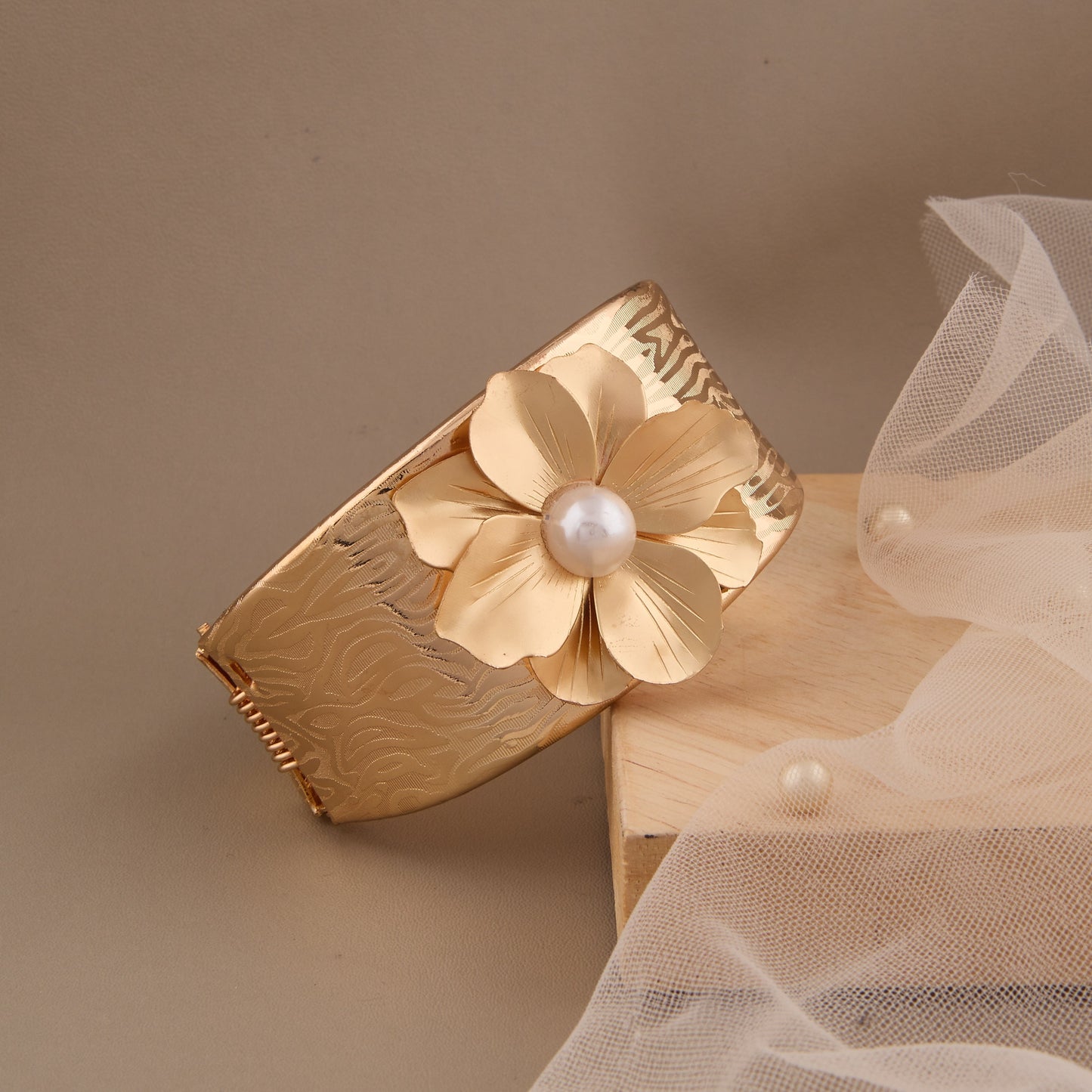 Textured Gold Cuff Bracelet with Pearl-Centered Golden Flower