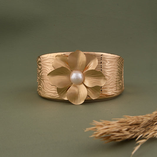 Textured Gold Cuff Bracelet with Pearl-Centered Golden Flower