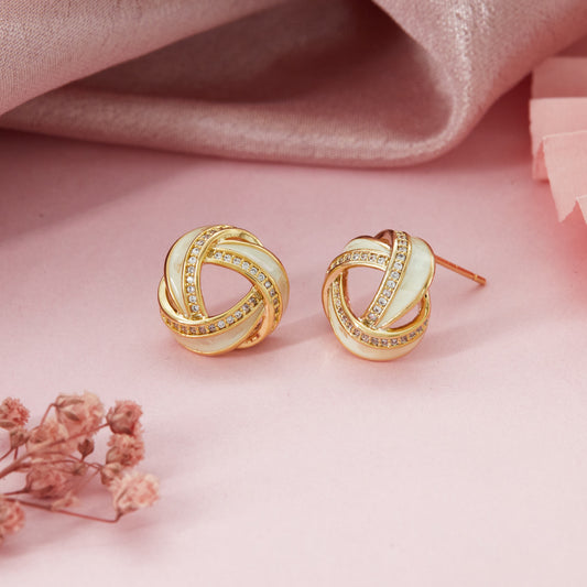 Gold Diamond Earrings Radiant Elegance on Soft Pink