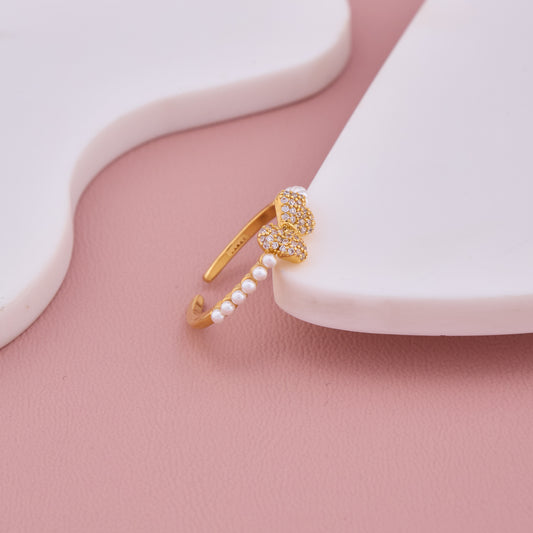Gold-Plated Pearl Band Ring with Dual Pave Heart Design