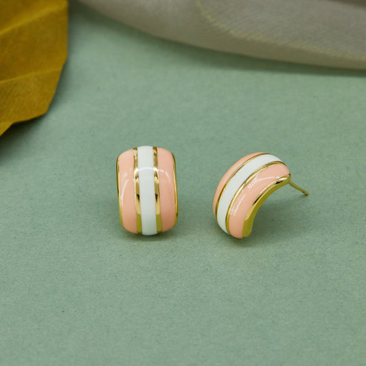 Elegant Earrings Highlighted on Vibrant Green