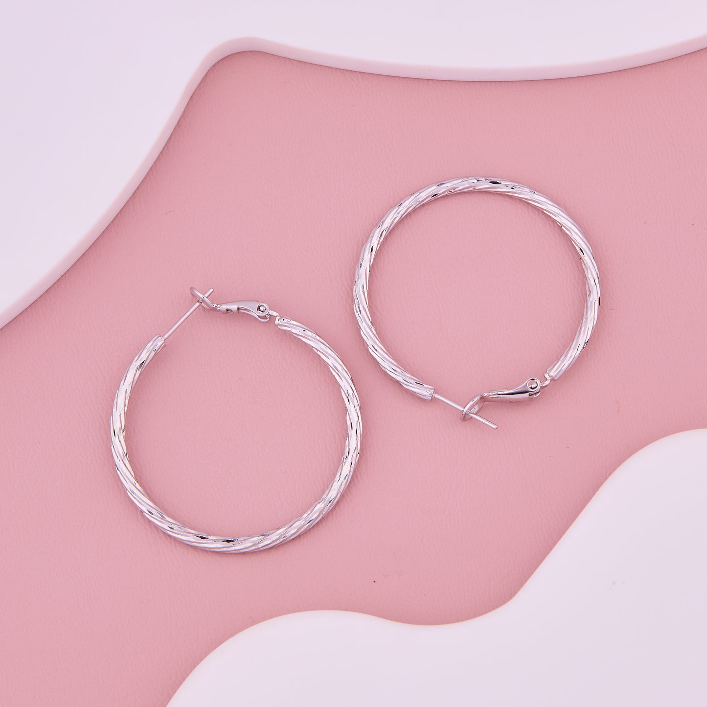 Radiant Diamond-Cut Silver Hoops