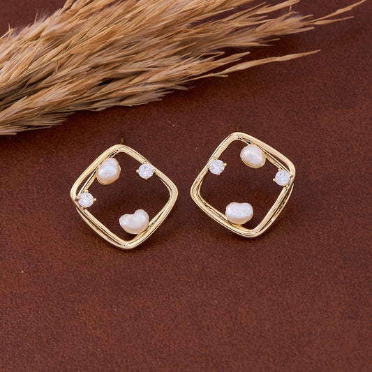 Gold & Pearl Earrings on Warm Tan