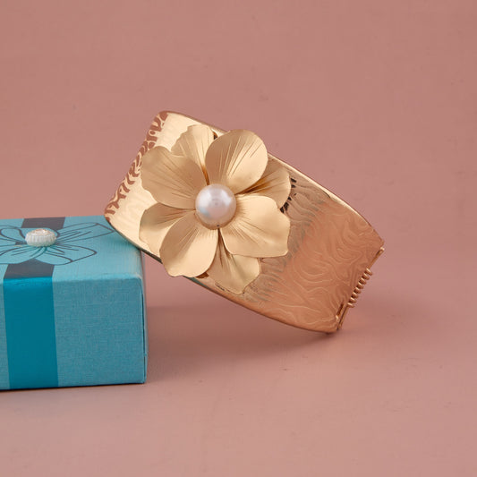 Textured Gold Cuff Bracelet with Pearl-Centered Golden Flower
