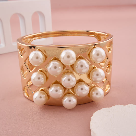 Gold-Tone Statement Bracelet with Pearl Embellishments