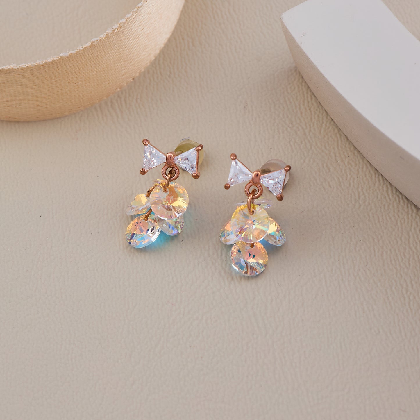 Rose Gold Bow Earrings with Iridescent Crystal Dangle Discs