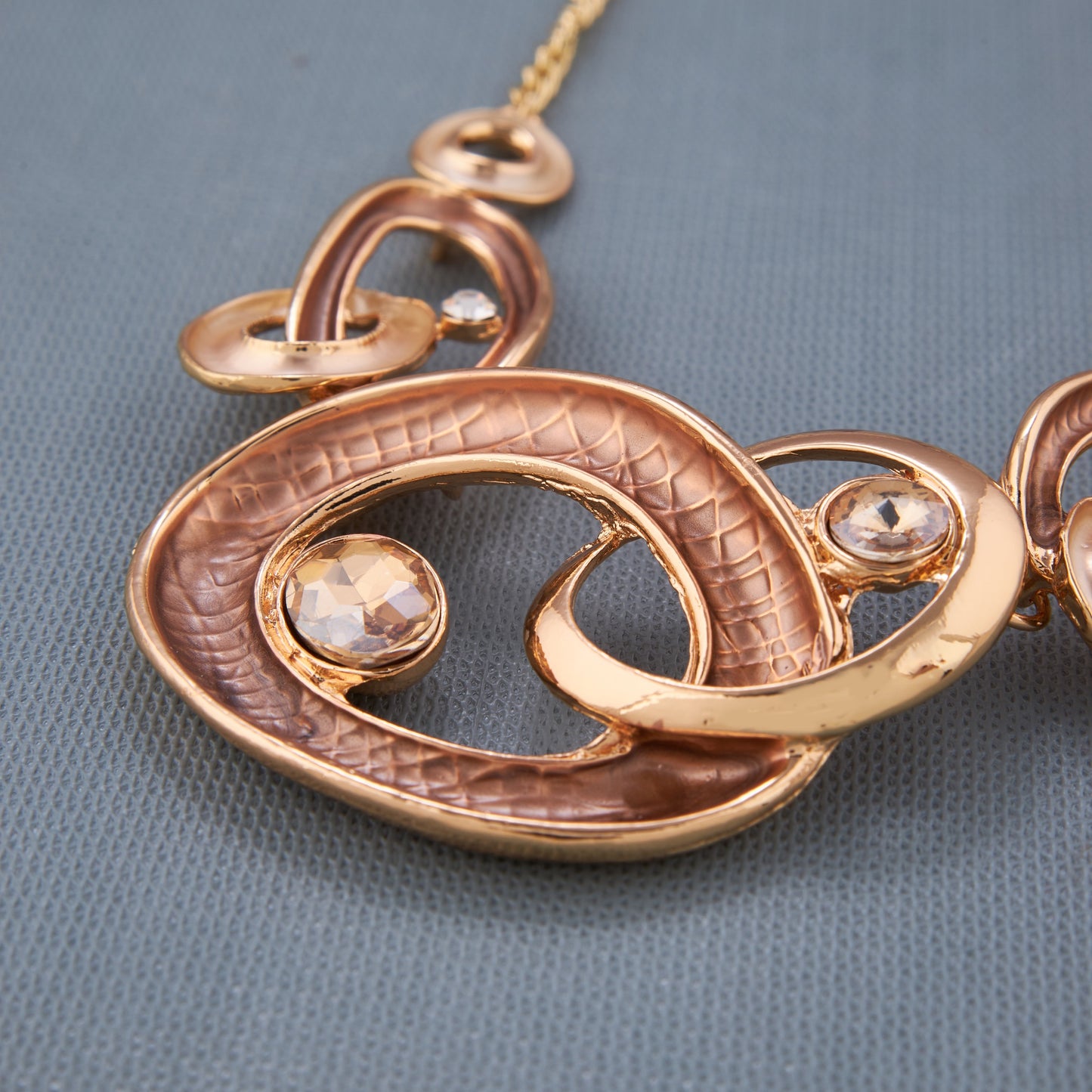 Stylish Gold-Toned Oval Necklace Set with Crystal Accents for Women