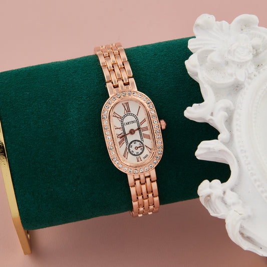 Elegant Rose Gold Oval Dial Women’s Watch with Crystal Bezel & Roman Numerals
