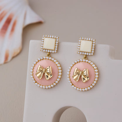 Pink and White Pearl Bow Drop Earrings with Gold Accents