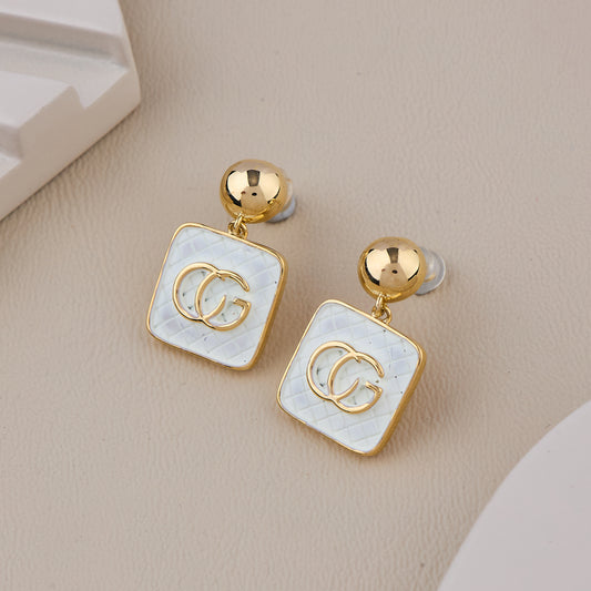 Elegant Gold-Plated Drop Earrings with White Enamel Squar