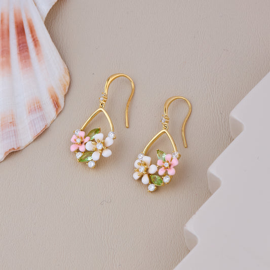 Gold Hook Earrings with White and Pink Flowers, Green Leaf Accents, and Crystal Detailing