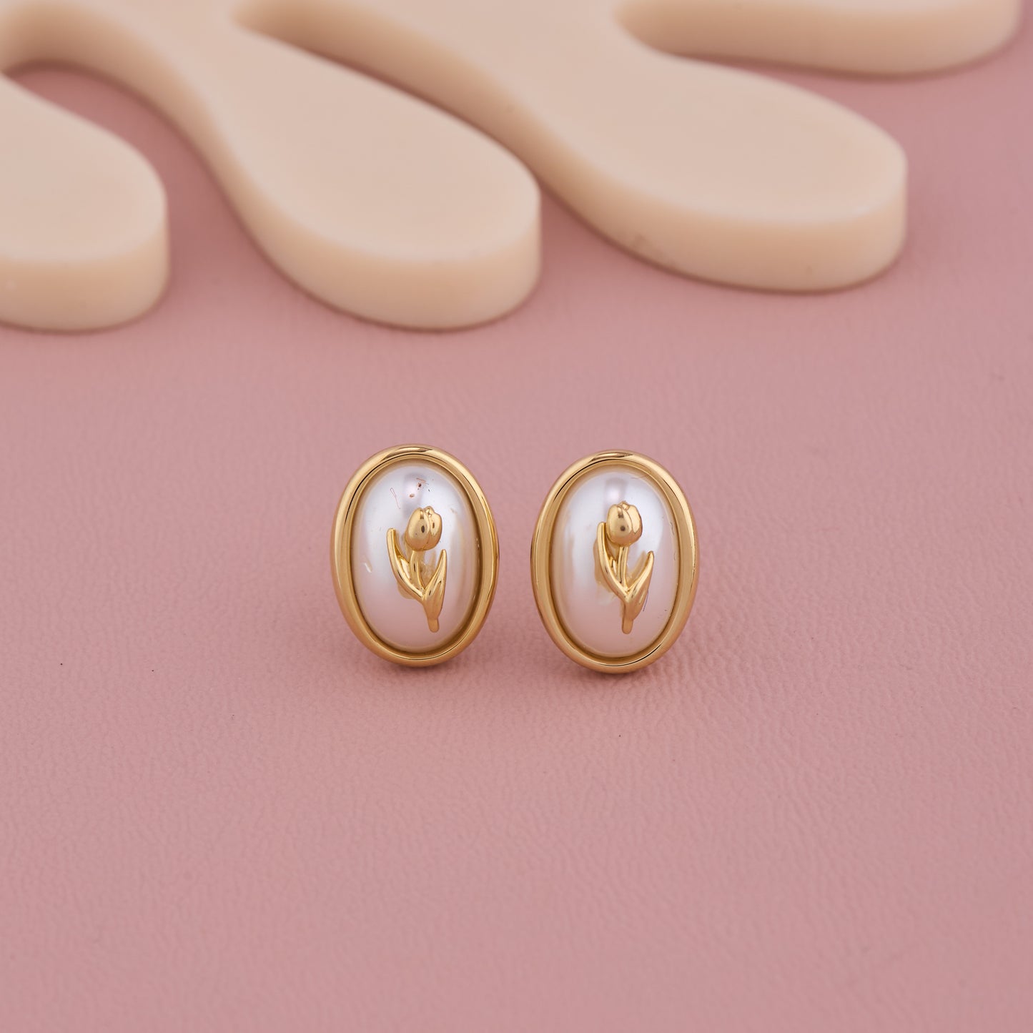 Elegant Oval Pearl Stud Earrings with Golden Floral Motif