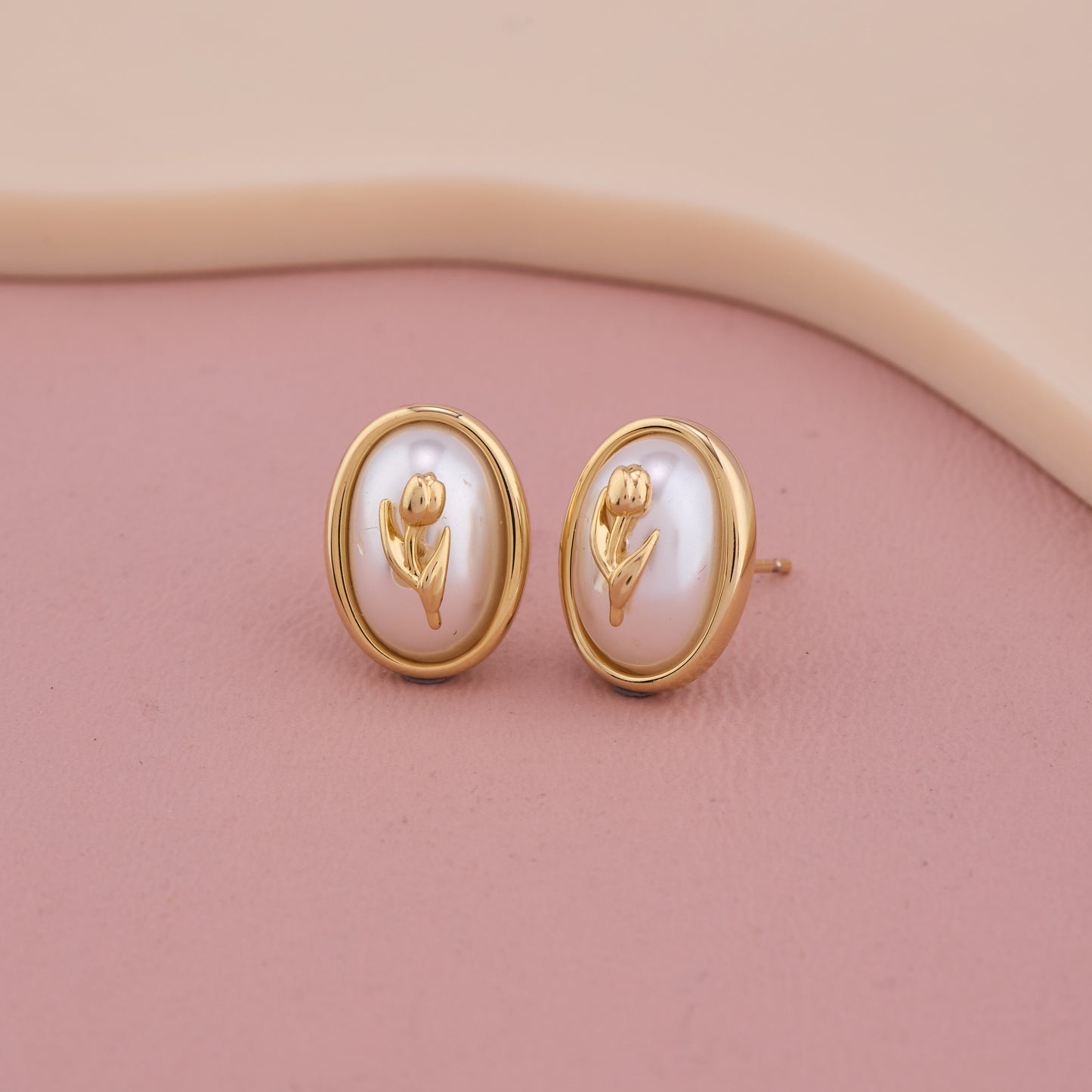 Elegant Oval Pearl Stud Earrings with Golden Floral Motif