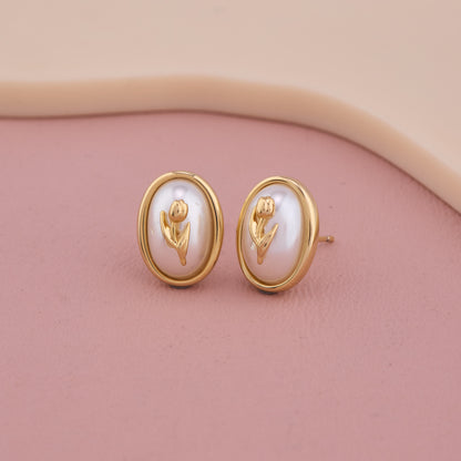 Elegant Oval Pearl Stud Earrings with Golden Floral Motif