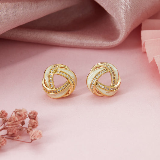 Gold Diamond Earrings Radiant Elegance on Soft Pink