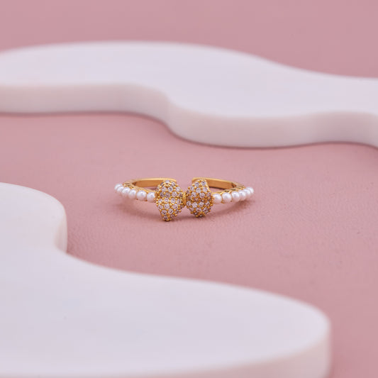Gold-Plated Pearl Band Ring with Dual Pave Heart Design