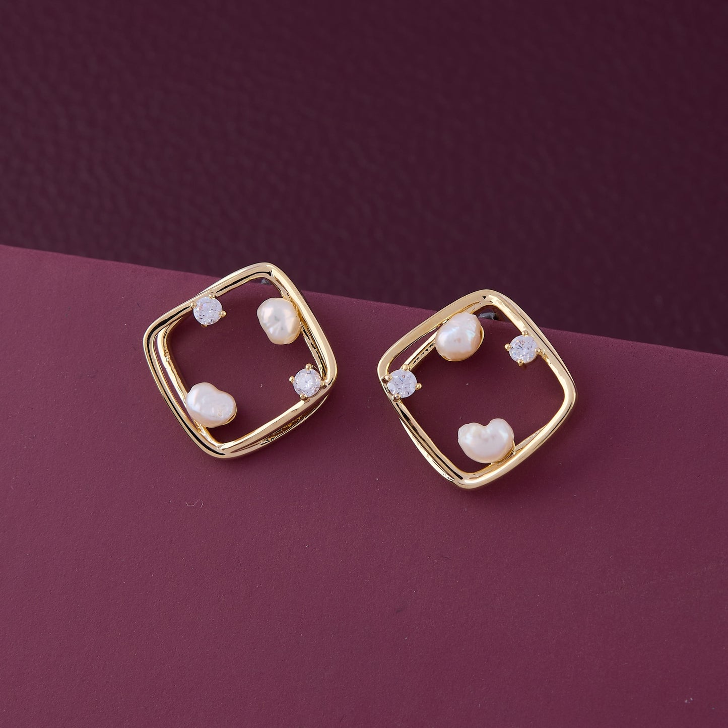 Gold & Pearl Earrings on Warm Tan