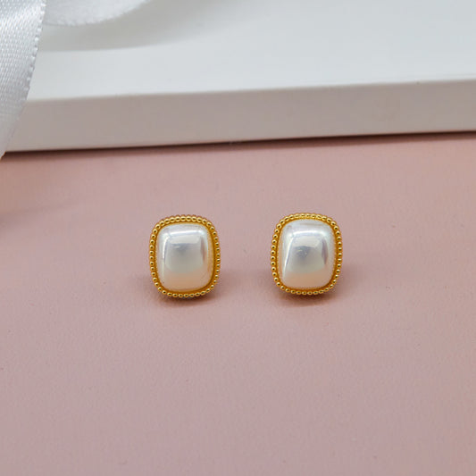 Elegant Earrings Intricate Craftsmanship on Pink Display