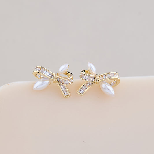 Elegant Pearl Bow Earrings with Crystal Detailing