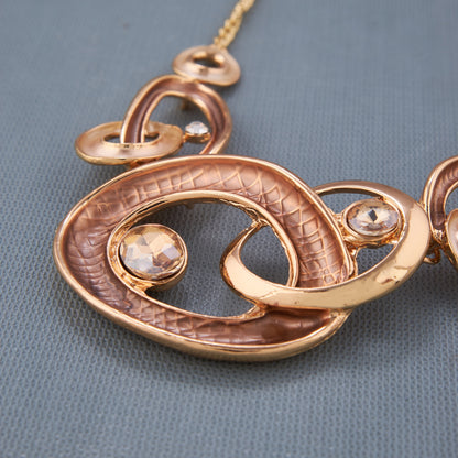 Stylish Gold-Toned Oval Necklace Set with Crystal Accents for Women
